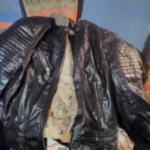 Black leather coat with sweater lining an hood